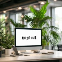 a modern office setting with innovative technology and a computer on a desk that says youve got mail in a fun font, with elements around the office